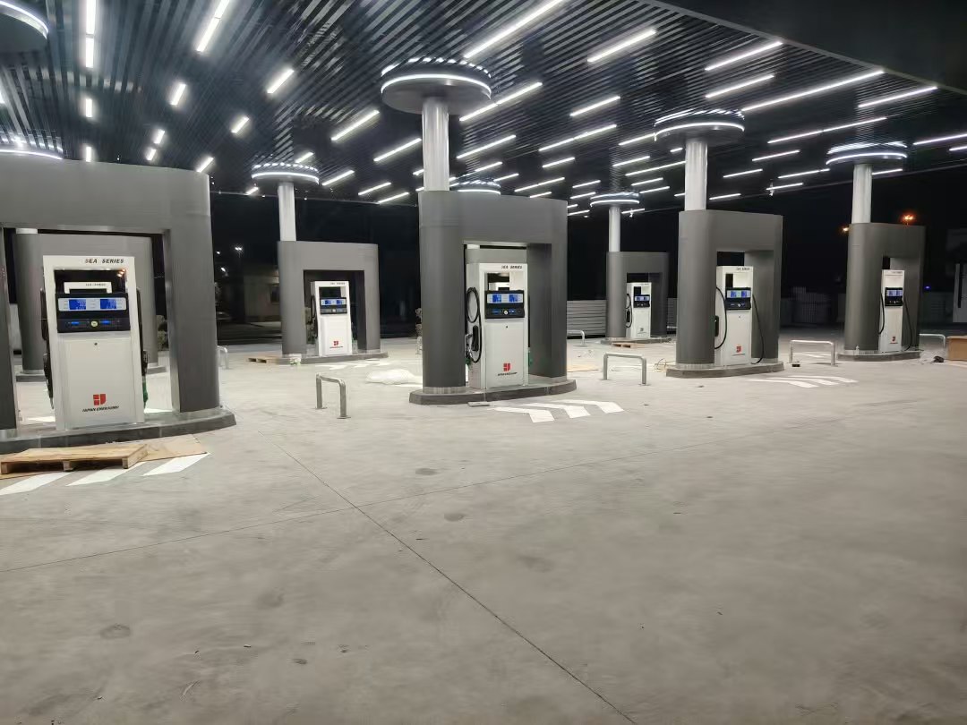 Dispenser islands framed by grey columns with ceiling lighting